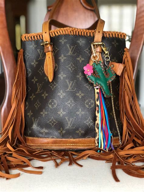 lv to tone tassel bag|Women's Designer Bags & Purses .